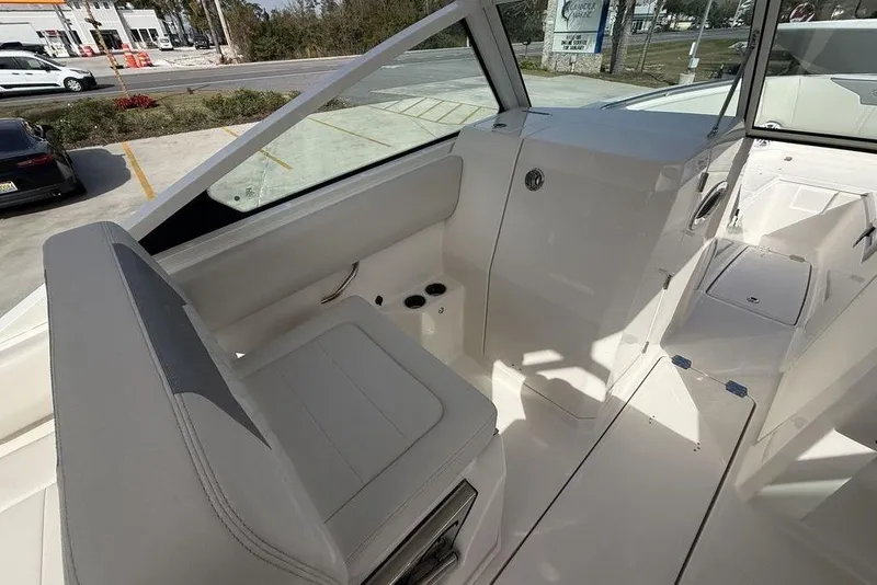 Slide: The Image of 2026 Sailfish 276 DC boat interior with seating and console, showcasing modern design. - 14