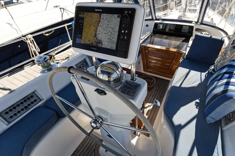 Slide: The Image of Cockpit of 2009 Hylas 46 yacht with navigation system and steering wheel. - 15