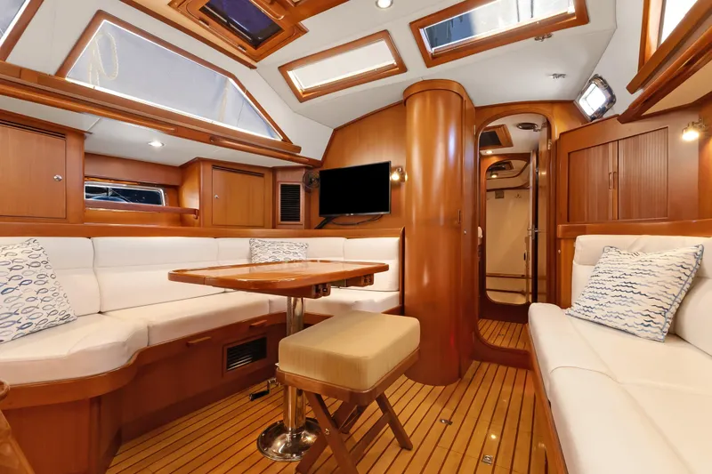 Slide: The Image of Luxurious interior of 2009 Hylas 46 yacht with wood finish and plush seating. - 25
