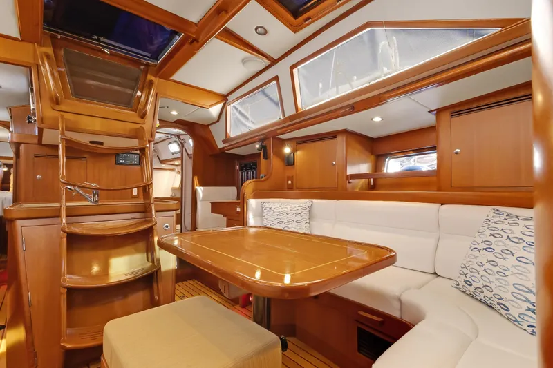 Slide: The Image of Luxurious interior of 2009 Hylas 46 yacht with wooden finishes and cozy seating. - 26
