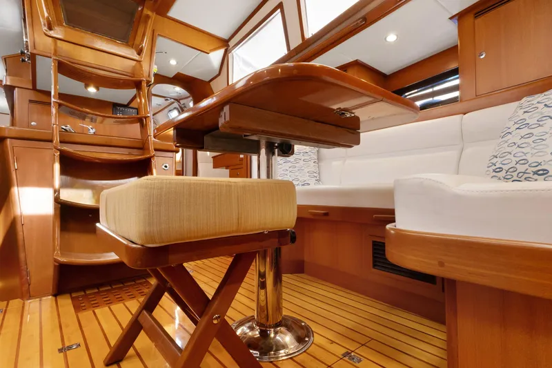 Slide: The Image of Luxurious interior of 2009 Hylas 46 yacht with wooden finishes and comfortable seating. - 27