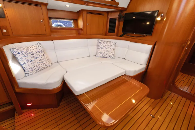 Slide: The Image of Luxurious interior of 2009 Hylas 46 yacht with white seating and wooden finishes. - 29
