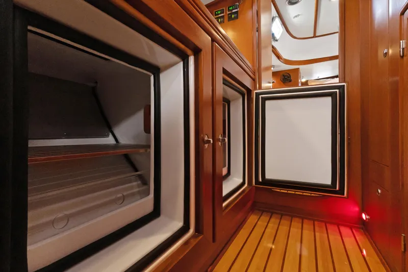 Slide: The Image of Interior of 2009 Hylas 46 yacht with open wooden cabinets and modern design. - 38