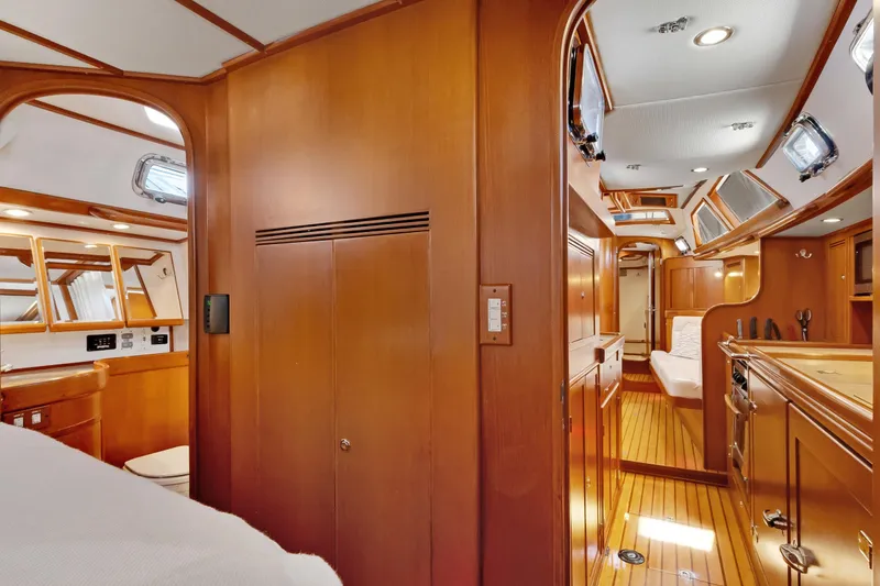 Slide: The Image of Interior of 2009 Hylas 46 yacht, featuring elegant wood finishes and modern amenities. - 41