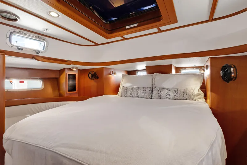 Slide: The Image of Luxurious cabin interior of a 2009 Hylas 46 yacht with cozy bedding. - 43