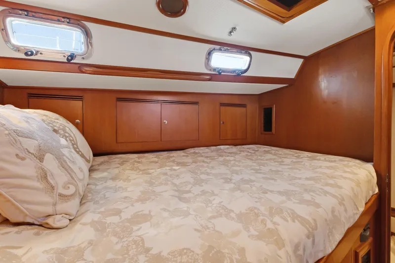 Slide: The Image of Cozy cabin interior of 2009 Hylas 46 yacht with wooden finish and seahorse pillow. - 50