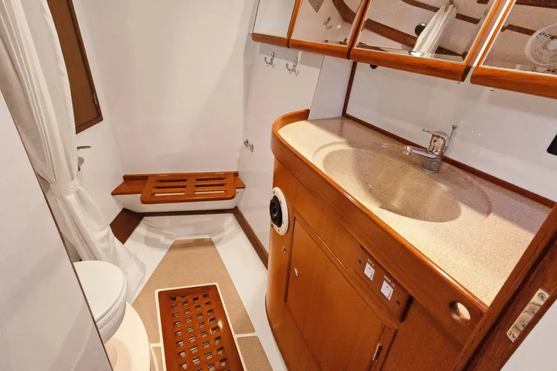 Slide: The Image of Luxurious bathroom in 2009 Hylas 46 yacht with wooden cabinetry and modern fixtures. - 52