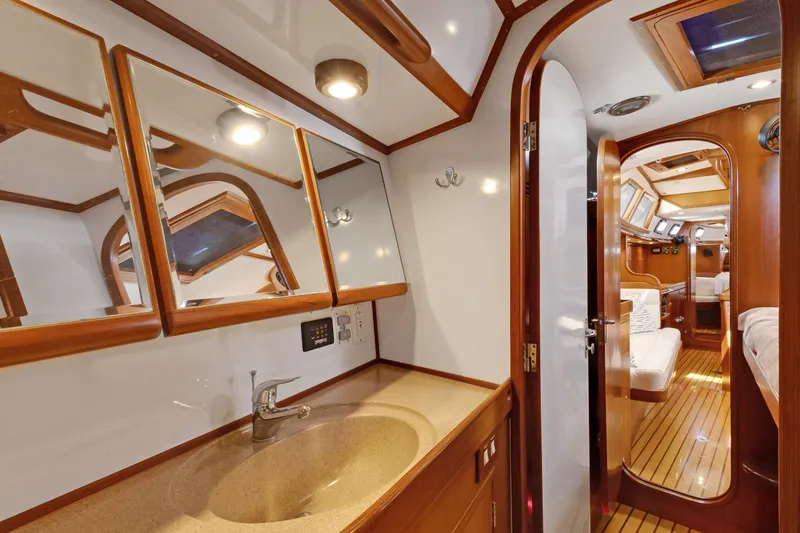 Slide: The Image of Luxurious 2009 Hylas 46 yacht interior with elegant wood finish and modern amenities. - 53