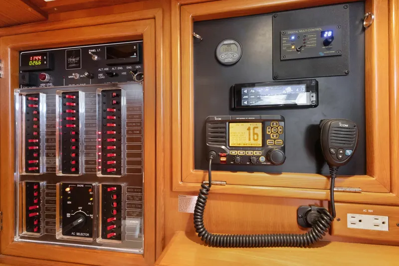 Slide: The Image of Control panel of a 2009 Hylas 46 yacht with radio and digital displays. - 55