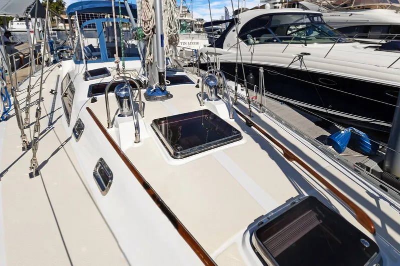 Slide: The Image of 2009 Hylas 46 sailboat deck with sleek design and modern fittings. - 7