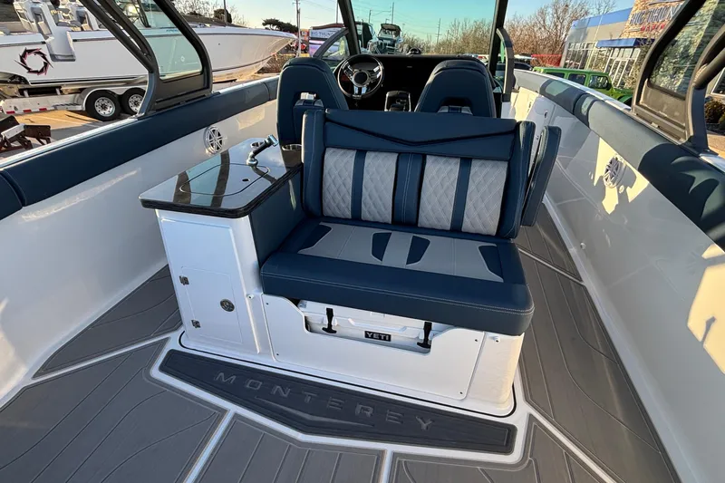 Slide: The Image of 2026 Monterey Elite 30 OB boat interior with luxurious seating and modern design. - 10