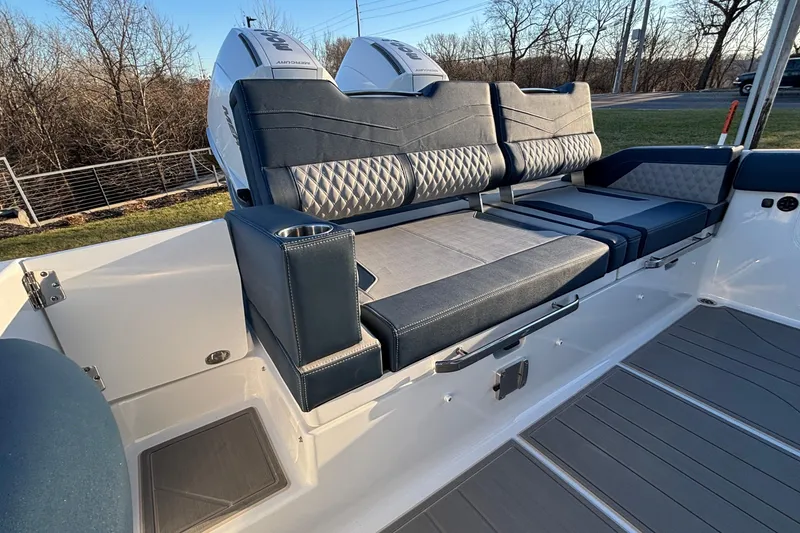 Slide: The Image of 2026 Monterey Elite 30 OB boat interior with luxurious seating and dual outboard engines. - 15