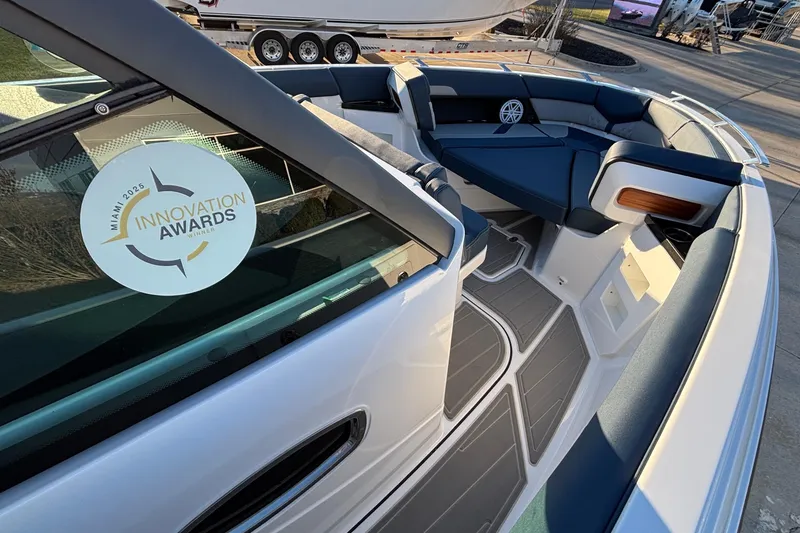 Slide: The Image of 2026 Monterey Elite 30 OB boat interior with Miami 2025 Innovation Awards sticker. - 26