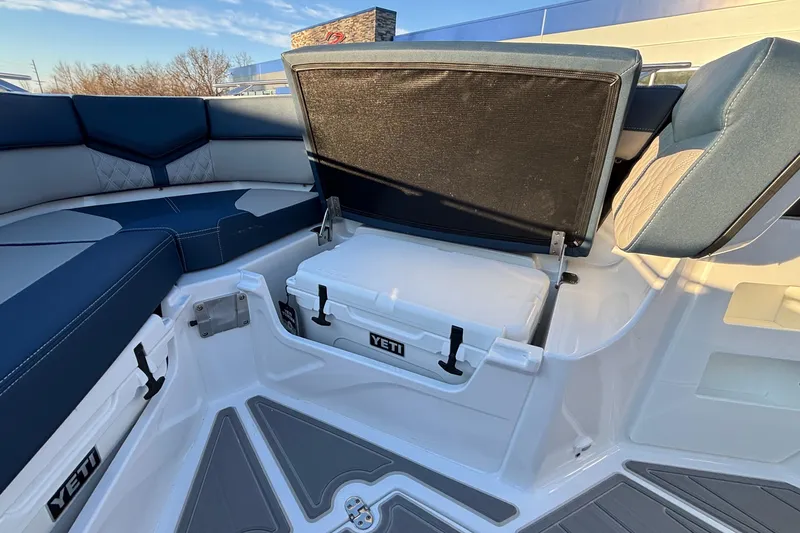 Slide: The Image of 2026 Monterey Elite 30 OB boat interior with Yeti cooler storage. - 34