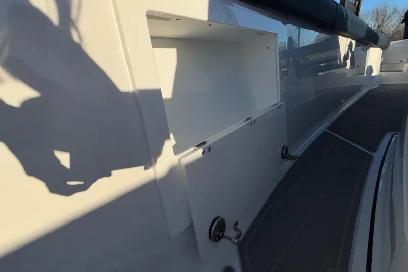 Slide: The Image of 2026 Monterey Elite 30 OB boat interior with storage compartment and sleek design. - 39