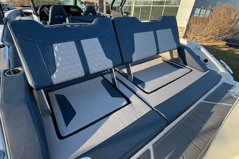 Slide: The Image of 2026 Monterey Elite 30 OB boat with luxurious seating and modern design. - 4