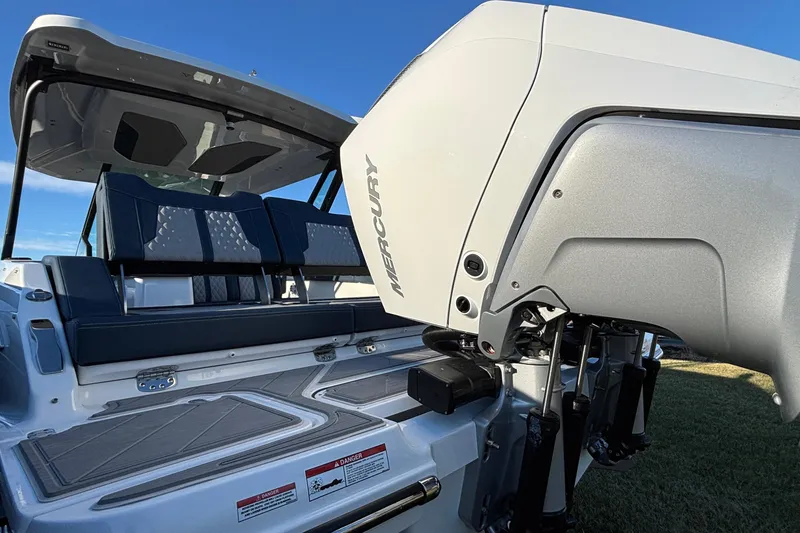 Slide: The Image of 2026 Monterey Elite 30 OB boat with Mercury engine, featuring sleek seating and modern design. - 47