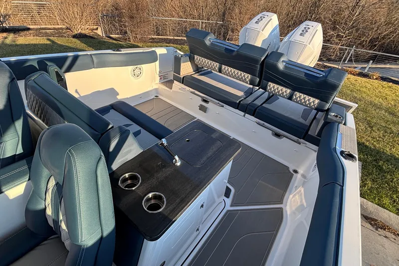 Slide: The Image of 2026 Monterey Elite 30 OB boat interior with luxurious seating and dual outboard engines. - 7