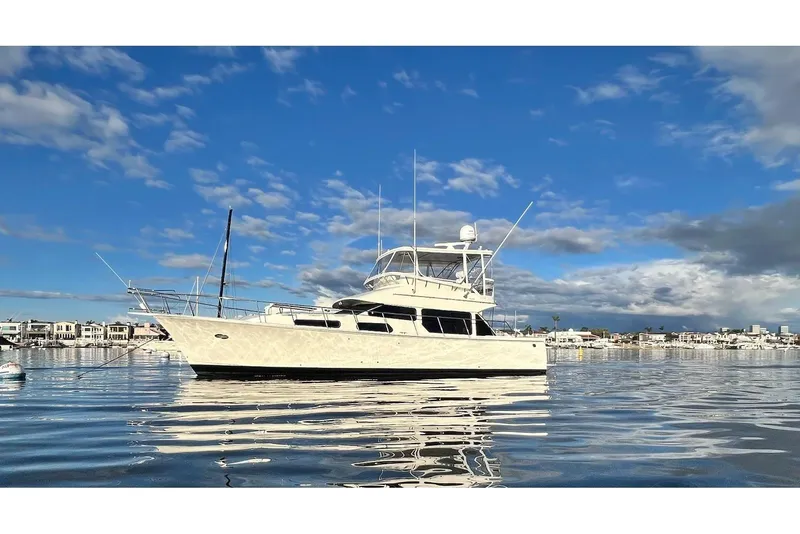 The Image of 2003 Mikelson 50 yacht on calm water under a blue sky. - 0