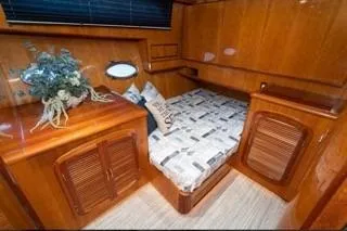 Slide: The Image of Luxurious cabin interior of a 2003 Mikelson 50 yacht with wooden furnishings. - 14