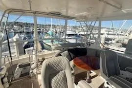 Slide: The Image of Interior view of a 2003 Mikelson 50 yacht with marina background. - 19