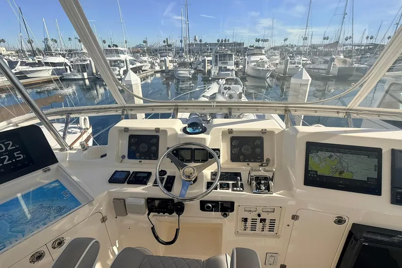 Slide: The Image of Helm of 2003 Mikelson 50 yacht with navigation equipment, docked in marina. - 23