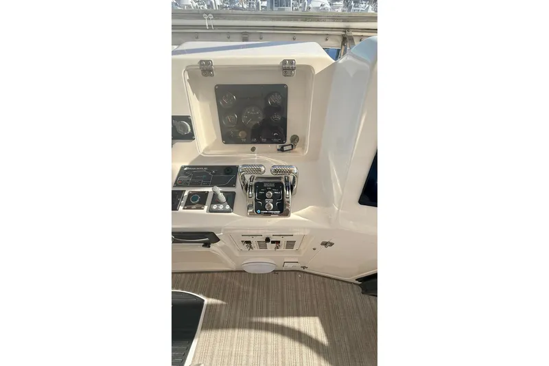 Slide: The Image of Control panel of a 2003 Mikelson 50 yacht with gauges and switches. - 31