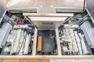 Slide: The Image of Engine room of 2003 Mikelson 50 yacht, showcasing dual engines and mechanical layout. - 37