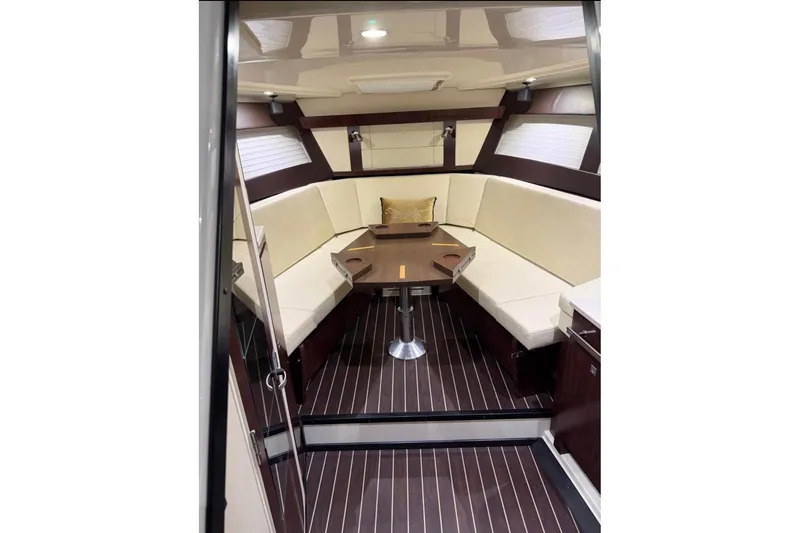 Slide: The Image of Luxurious interior of 2015 Monterey 360 Sport Coupe with elegant seating and wooden flooring. - 15