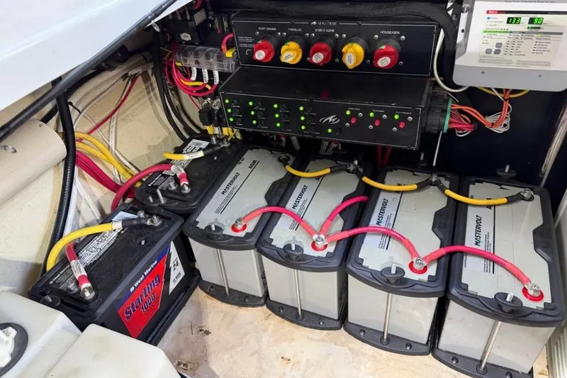 Slide: The Image of Electrical system of a 2015 Monterey 360 Sport Coupe with multiple batteries and wiring. - 24