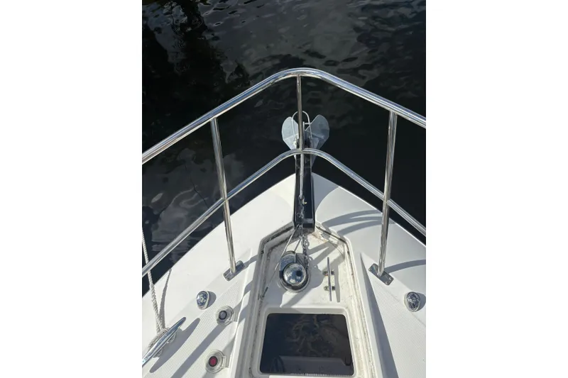 Slide: The Image of Bow of 2015 Monterey 360 Sport Coupe with anchor and railing, docked on water. - 3