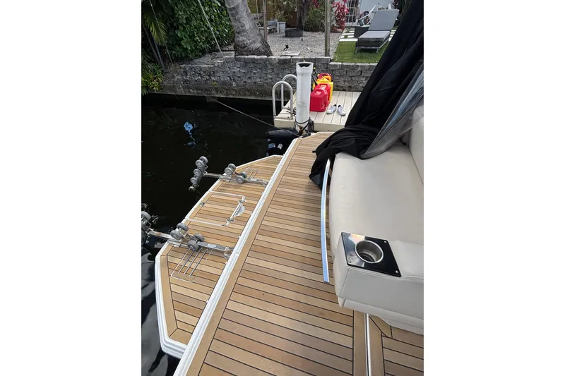 Slide: The Image of 2015 Monterey 360 Sport Coupe boat deck with seating and cup holder. - 4