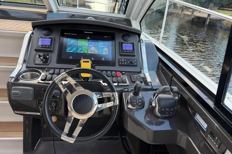 Slide: The Image of Cockpit of 2015 Monterey 360 Sport Coupe with advanced navigation controls and steering wheel. - 7