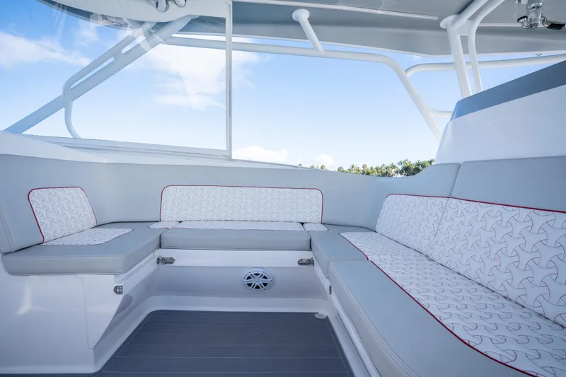 Slide: The Image of Luxurious seating area on 2022 Intrepid 409 Valor boat, featuring stylish upholstery and modern design. - 12