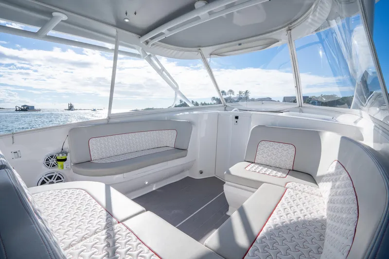 Slide: The Image of Luxurious interior of 2022 Intrepid 409 Valor boat with comfortable seating and ocean view. - 13