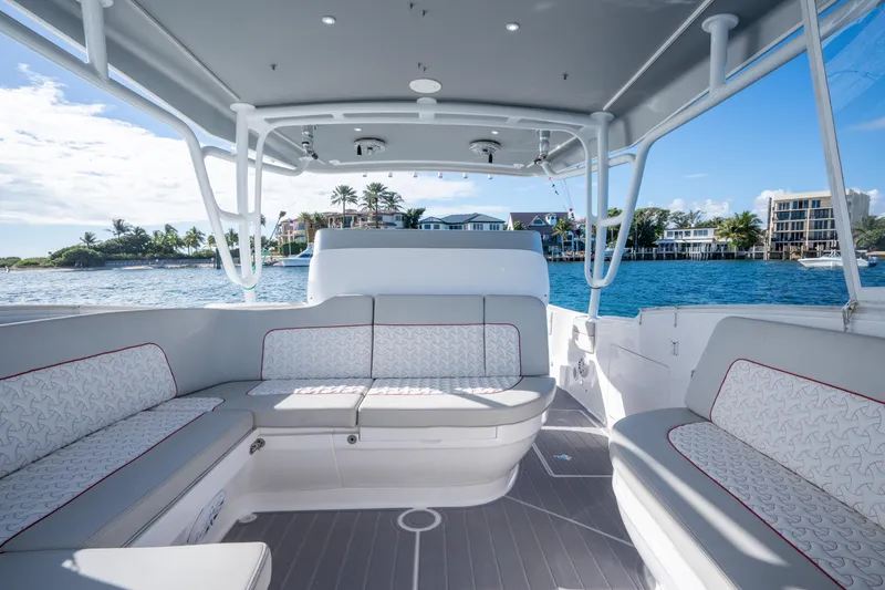 Slide: The Image of Luxurious 2022 Intrepid 409 Valor boat interior with elegant seating and ocean view. - 15