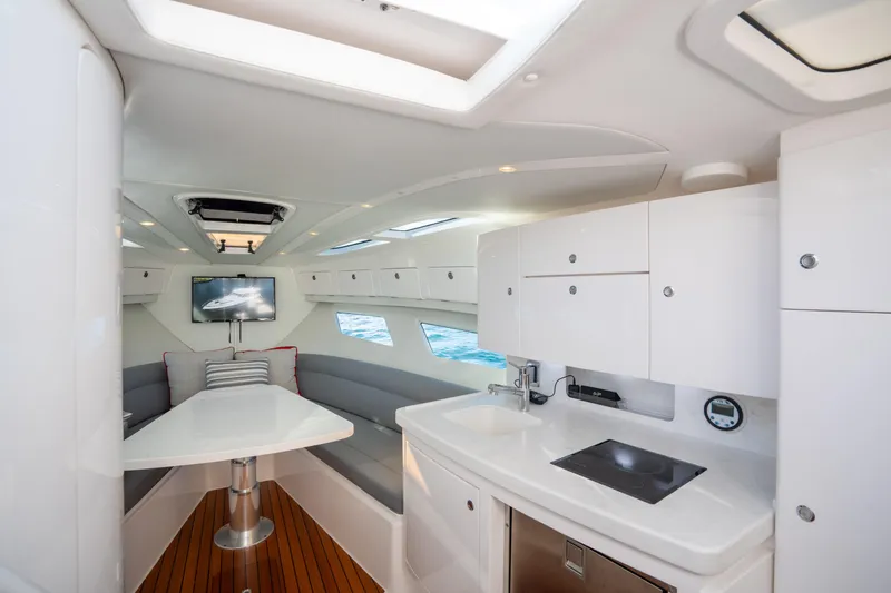Slide: The Image of Luxurious interior of 2022 Intrepid 409 Valor yacht with modern kitchen and seating area. - 35