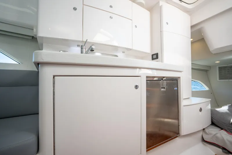 Slide: The Image of Modern kitchen interior on 2022 Intrepid 409 Valor yacht, featuring sleek cabinetry and stainless steel appliances. - 39