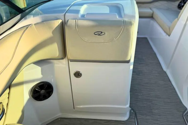 Slide: The Image of Interior view of a 2019 Regal 23 OBX boat, featuring seating and storage. - 13