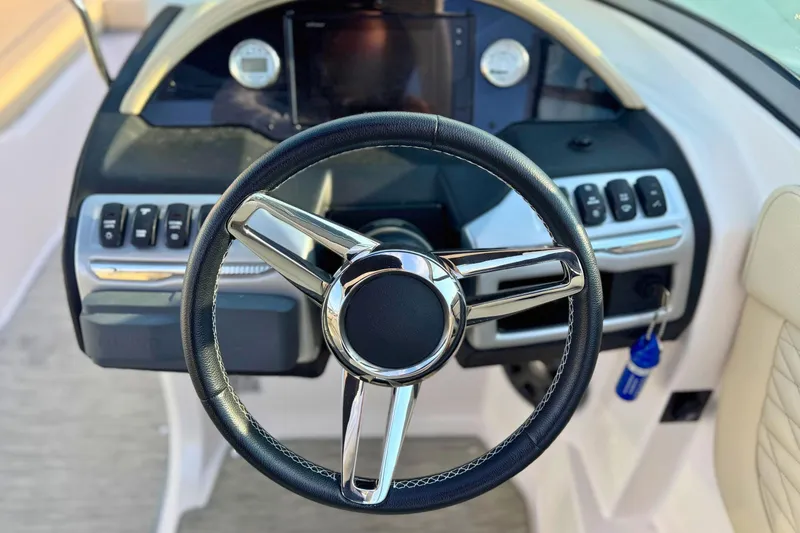 Slide: The Image of Steering wheel and dashboard of 2019 Regal 23 OBX boat. - 18