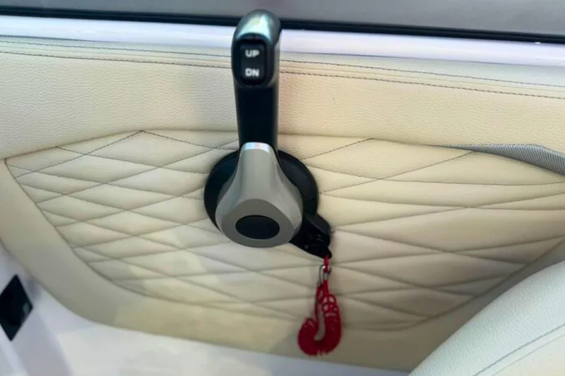 Slide: The Image of 2019 Regal 23 OBX interior with quilted leather and control lever detail. - 20