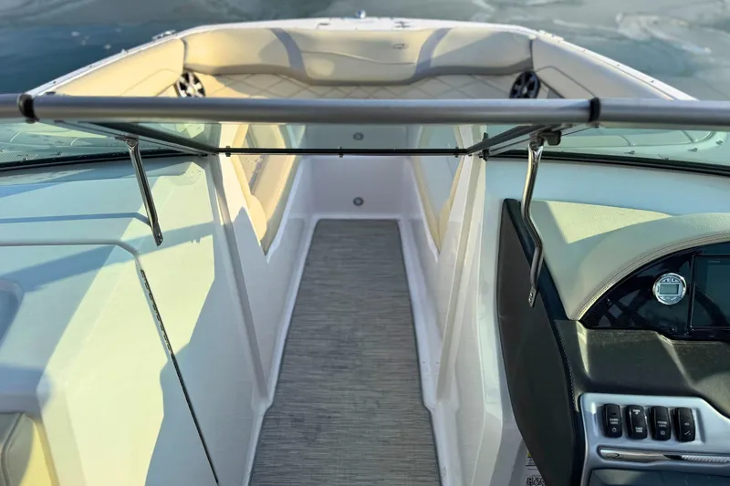 Slide: The Image of 2019 Regal 23 OBX boat interior with sleek dashboard and spacious seating. - 21