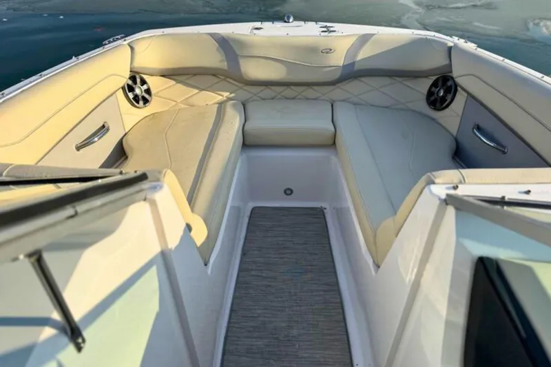 Slide: The Image of 2019 Regal 23 OBX boat interior with beige seating and marine speakers. - 22