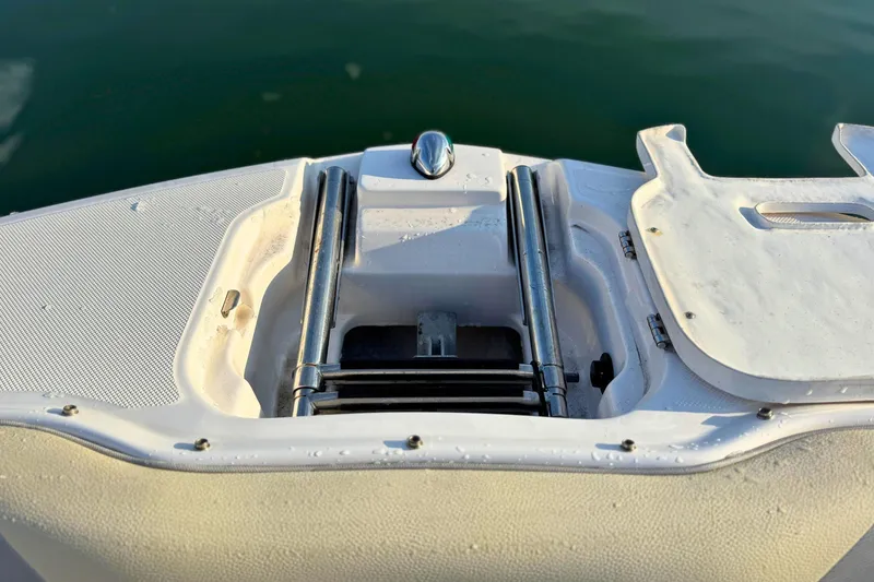 Slide: The Image of 2019 Regal 23 OBX boat swim platform with ladder, close-up view. - 25