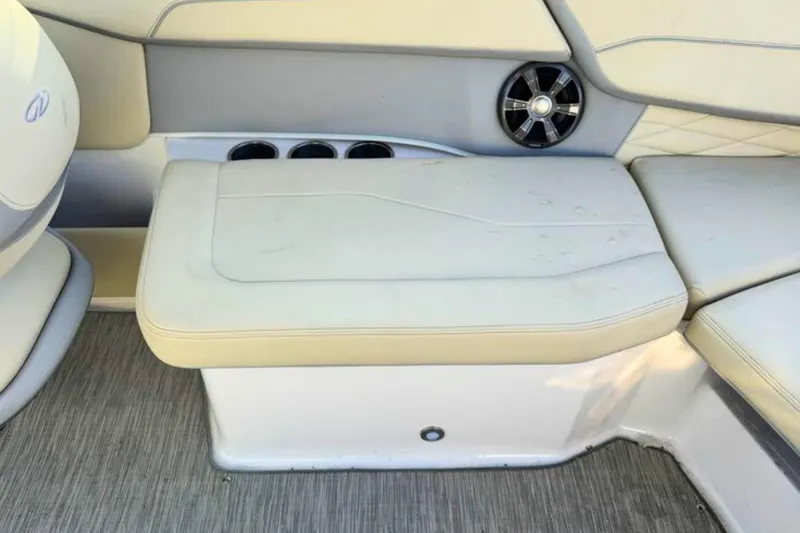 Slide: The Image of 2019 Regal 23 OBX boat interior with cushioned seating and speaker. - 7