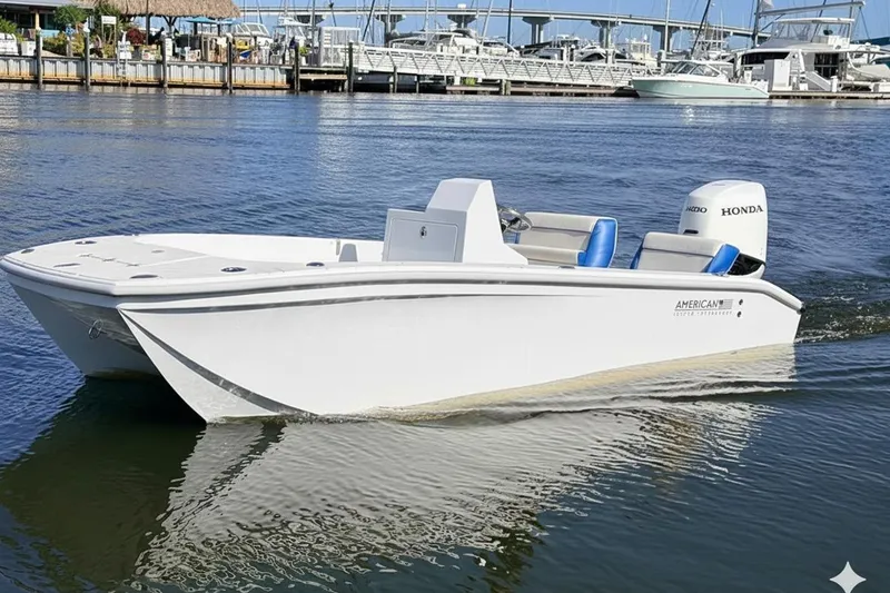 The Image of 2026 American Custom Catamarans 17 on water, featuring sleek design and Honda engine. - 1