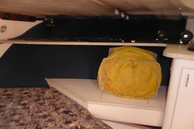 Slide: The Image of Interior of a 1996 Luhrs 320 Tournament boat with yellow storage bag. - 16