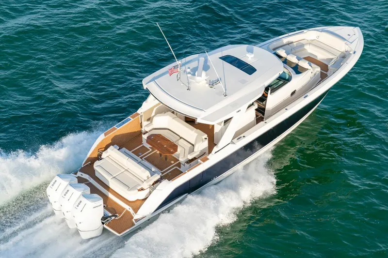 Slide: The Image of Manufacturer Provided Image: 2025 Tiara Yachts 48 LS cruising on open water, showcasing luxury design and powerful engines. - 3