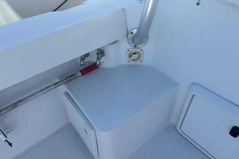 Slide: The Image of 2002 Luhrs 32 Open boat deck corner with storage and railing. - 12