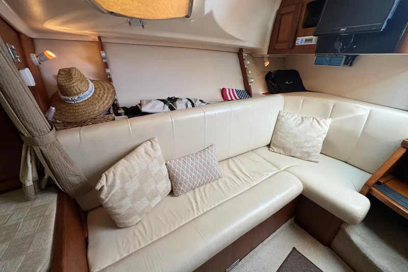 Slide: The Image of Luxurious interior of 2002 Luhrs 32 Open yacht with cream leather seating and cushions. - 20